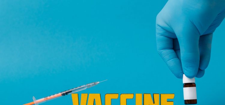 covid vaccine on blue surface