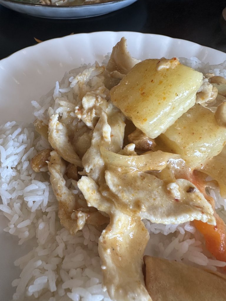Massaman curry with chicken and steamed rice.